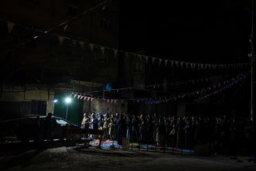 Muslim worshippers perform tarawih, an extra lengthy prayer held during the Muslim holy month of Ramadan, in Rafah, Gaza Strip, Sunday, March 10, 2024. (AP)