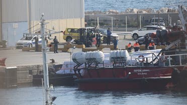 Humanitarian aid for Gaza, loaded on a platform is pictured next to a rescue vessel of the Spanish NGO Open Arms at the port of Larnaca, Cyprus, on March 12, 2024. (Reuters)