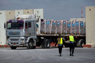 A truck carrying humanitarian aid bound for the Gaza Strip drives at the inspection area at the Kerem Shalom crossing, amid the ongoing conflict between Israel and the Palestinian militia group Hamas, in southern Israel, March 14, 2024. (Reuters)