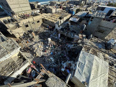 Palestinians inspect the site of an Israeli strike on a house, amid the ongoing conflict between Israel and the Palestinian group Hamas, in Rafah in the southern Gaza Strip March 8, 2024. (Reuters)