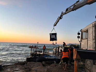 This photo provided by World Central Kitchen shows a crane unloading food packages over a makeshift port on the Gaza Strip, Saturday, March 16, 2024. (File photo:  AP)