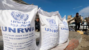 Displaced Palestinians wait to receive United Nations Relief and Works Agency (UNRWA) aid, in Rafah, in the southern Gaza Strip. (File photo: Reuters)