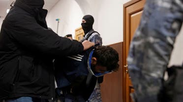 Dalerdzhon Mirzoyev, a suspect in the shooting attack at the Crocus City Hall concert venue, is escorted before a court hearing in the Basmanny district court in Moscow, Russia March 24, 2024. REUTERS/Yulia Morozova