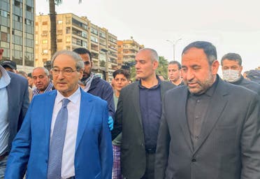 Syrian Foreign Minister Faisal al-Mekdad walks with Iran’s ambassador in Damascus Hossein Akbari, near a damaged site after what the Iranian media said was an Israeli strike on the Iranian consulate in Damascus, Syria, April 1, 2024. (Reuters)