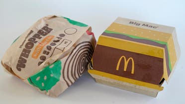 A Burger King Whopper in a wrapper, left, rests next to a McDonald's Big Mac in a container, in Walpole, Mass., Wednesday, April 20, 2022. (File photo: AP)