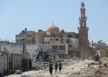 Palestinians inspect destroyed residential buildings and a mosque, after the Israeli military withdrew most of its ground troops from the southern Gaza Strip, amid the ongoing conflict between Israel and Hamas, in Khan Younis, in the southern Gaza Strip April 7, 2024. (Reuters)