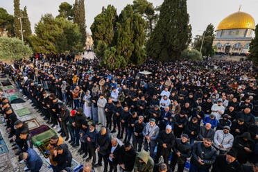 Muslims offer special morning prayers to start the Eid al-Fitr festival, which marks the end of the holy fasting month of Ramadan, at the Al-Aqsa Mosque compound in Jerusalem on April 10, 2024.  (AFP)