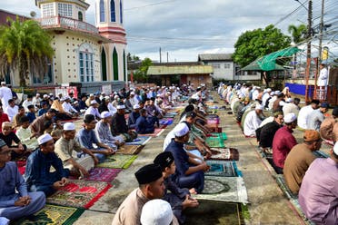 Thai Muslims offer prayers at the start of the Eid al-Fitr festival, which marks the end of their holy fasting month of Ramadan, in the southern Thai province of Narathiwat on April 10, 2024. (AFP)