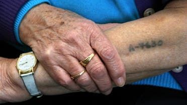 Holocaust survivor Bracha Ghilai, 75, shows her tattooed arm at her house in Holon near Tel Aviv, Israel, Jan. 23, 2005. (File photo: AP)