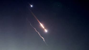 Objects are seen in the sky above Jerusalem after Iran launched drones and missiles towards Israel, in Jerusalem April 14, 2024. REUTERS/Ronen Zvulun TPX IMAGES OF THE DAY