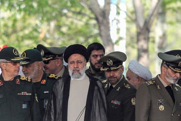 Iran’s President Ebrahim Raisi (C) attends a military parade alongside high-ranking officials and commanders during a ceremony marking the country’s annual Army Day in Tehran on April 17, 2024. (AFP)