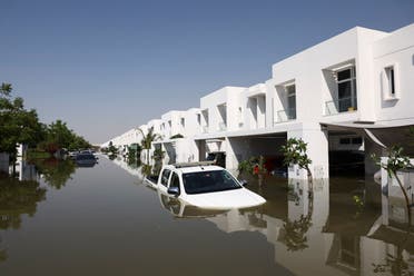 Cars lie partially submerged in water at a residential complex following heavy rainfall, in Dubai, United Arab Emirates, April 18, 2024. (Reuters)