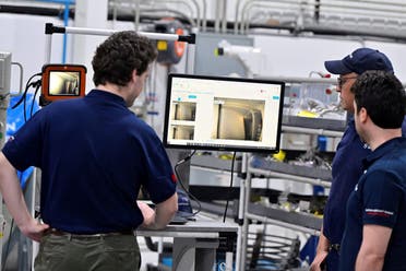 Engineers and workers stand inside Safran Aircraft Engines repair plant outside of Casablanca, Morocco, Thursday, April 18, 2024. (AP)