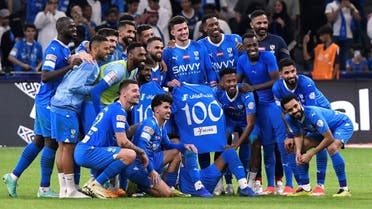 Al Hilal players pose for a picture after their Saudi Pro League match against Al Fateh at the Kingdom Arena stadium in Riyadh on April 26, 2024. (Reuters)