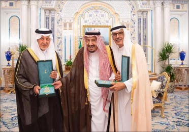 Saudi poet Prince Badr bin Abdul Mohsin confered with the King Abdulaziz Sash by Saudi King Salman bin Abdulaziz. (SPA)