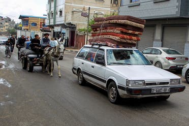 People flee the eastern parts of Rafah after the Israeli military began evacuating Palestinian civilians ahead of a threatened assault on the southern Gazan city, amid the ongoing conflict between Israel and Hamas, in Rafah, in the southern Gaza Strip May 6, 2024. (Reuters)