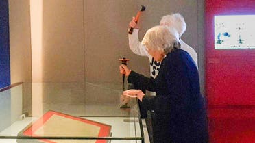 Climate activists Reverend Dr Sue Parfitt, 82, and Judy Bruce, 85, break parts of the reinforced case holding an original text of the Magna Carta in the British Library in London, Britain May 10, 2024, in this picture obtained from social media. (Reuters)