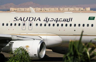 Saudi Arabian Airlines plane, is seen at the airport of the Red Sea resort of Sharm el-Sheikh, Egypt, August 9, 2021. Picture taken through a window. 