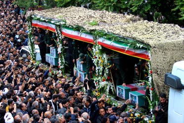 In this photo provided by Fars News Agency, mourners gather around a truck carrying coffins of Iranian President Ebrahim Raisi and his companions who were killed in their helicopter crash on Sunday in mountainous region of the country's northwest, during a funeral ceremony at the city of Tabriz, Iran, Tuesday, May 21, 2024. (AP)