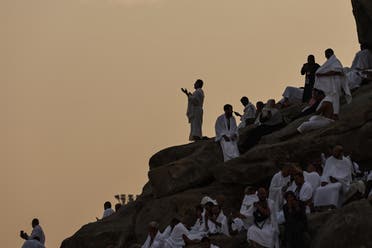 Muslim pilgrims pray at dawn on Saudi Arabia's Mount Arafat, also known as Jabal al-Rahma or Mount of Mercy, during the climax of the Hajj pilgrimage on June 15, 2024. (AFP)