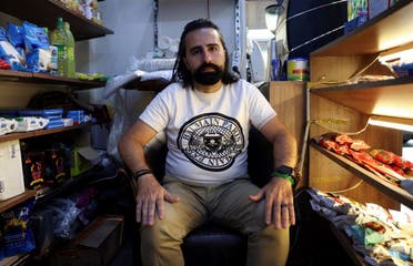 Sami Masri, a 38-year-old businessman from the south, attends an interview with Reuters at his coffeeshop in Hamra, Lebanon June 20, 2024. (Reuters)