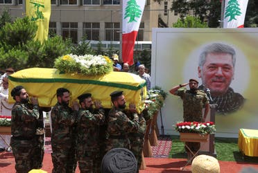 Members of Hezbollah carry the coffin of Taleb Abdallah, also known as Abu Taleb, a senior field commander of Hezbollah who was killed by what security forces say was an Israel strike yesterday night, during his funeral in Beirut's southern suburbs, Lebanon June 12, 2024. (Reuters)