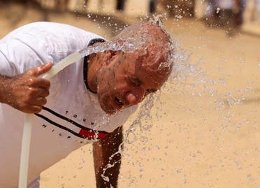 A man cools himself with water, amid a heatwave in Al Fayoum Governorate, southwest of Cairo, Egypt August 12, 2023. (File photo: Reuters)