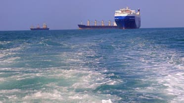 A picture taken during an organized tour by Yemen’s Houthi rebels on Nov. 22, 2023 shows the Galaxy Leader cargo ship, right, seized by Houthi fighters approaching the port in the Red Sea off Yemen’s province of Hodeidah. (AFP)