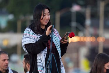 Sue Han, a friend of the 26-year old Aysenur Ezgi Eygi, killed recently in the occupied West Bank, during vigil on Alki Beach, Wednesday, Sept. 11, 2024, in Seattle. Eygi grew up in Seattle, attended Seattle Public Schools and graduated from the University of Washington. (AP Photo/John Froschauer)