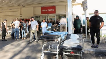  People gather outside a hospital, as hundreds of members of the Lebanese armed group Hezbollah, including fighters and medics, were seriously wounded when the pagers they use to communicate exploded, according to a security source, in Beirut, Lebanon, on September 17, 2024. (Reuters)