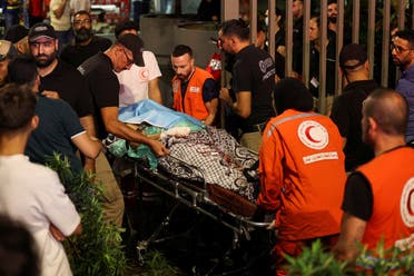 A person is carried on a stretcher outside American University of Beirut Medical Center (AUBMC) as people, including Hezbollah fighters and medics, were wounded and killed when the pagers they use to communicate exploded across Lebanon, according to a security source, in Beirut, Lebanon September 17, 2024. (Reuters)