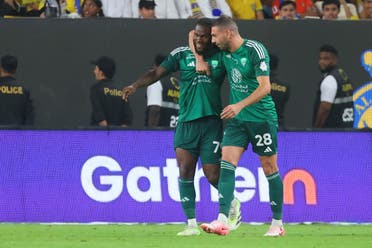 Ahli's Ivorian midfielder #79 Franck Kessie celebrates scoring with Ahli's Turkish defnder #28 Merih Demiral during the Saudi Pro League football match between Al-Ahli and Al-Nassr at at al-Awwal Stadium in Riyadh on September 13, 2024. (AFP)