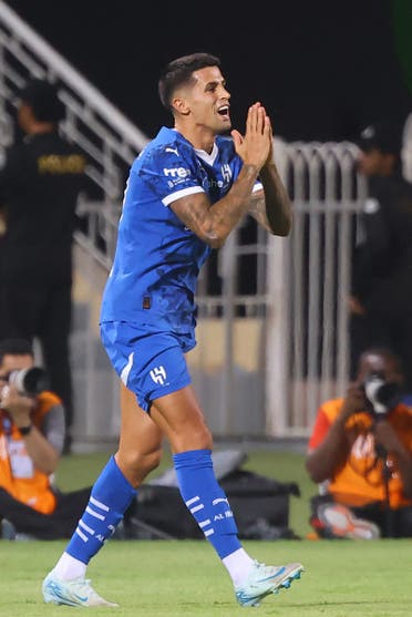 Hilal's Portuguese defender #20 Joao Cancelo gestures on the pitch during the Saudi Pro League football match between Al-Hilal and al-Riyadh at the Prince Faisal bin Fahd Sports City in Riyadh on September 14, 2024.  (AFP)