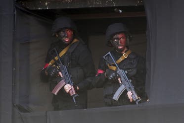 Lebanese Hezbollah members carry their weapons in this file photo. (Reuters)