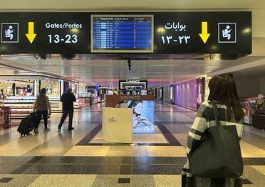 Passengers walk past duty-free shops inside Beirut-Rafic Al Hariri International Airport, in Beirut, Lebanon October 2, 2024. (Reuters)