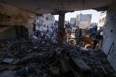 Palestinians inspect the damage on the site of an overnight Israeli airstrike on the Tulkarem refugee camp in the north of the occupied West Bank on October 4, 2024. (Photo by JAAFAR ASHTIYEH / AFP)