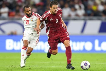 UAE's midfielder #08 Tahnoon Hamdan vies for the ball with Qatar's forward #03 Lucas Mendes during the FIFA World Cup 2026 Asia zone qualifiers football match between Qatar and the United Arab Emirates at the Ahmad Bin Ali Stadium on September 5, 2024. (AFP)