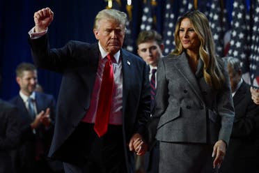 Republican presidential nominee and former U.S. President Donald Trump holds up a fist as he takes the stage with his wife Melania and son Barron, following early results from the 2024 U.S. presidential election in Palm Beach County Convention Center, in West Palm Beach, Florida, U.S., November 6, 2024. 