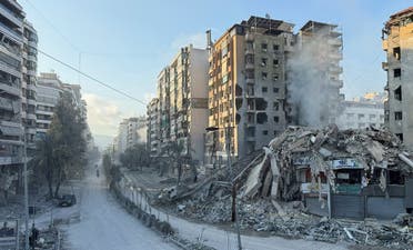 People ride their motorbikes past damaged buildings in the aftermath of Israeli strikes on Beirut's southern suburbs, amid the ongoing hostilities between Hezbollah and Israeli forces, Lebanon, November 13, 2024. (Reuters)