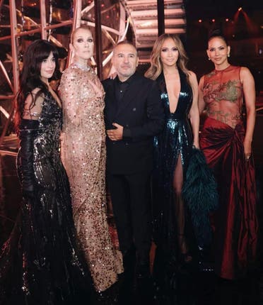 Elie Saab (C) in surrounded by Camila Cabello, Celine Dion (L) and Jennifer Lopez and Halle Berry (R). (X) 