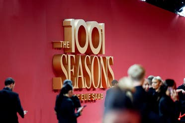 Guests arrive as the logo of 'The 1001 Season of ELIE SAAB' is pictured at the red carpet ahead of a fashion show celebrating the Lebanese fashion designer Elie Saab's 45 year career as part of Riyadh Season in Riyadh, Saudi Arabia, November 13, 2024. (Reuters)