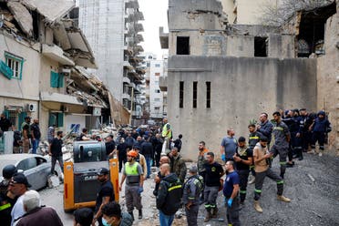 People and rescuers gather at the site of an Israeli strike on a building that according to security sources killed Hezbollah's media relations chief Mohammad Afif in Ras Al- Nabaa, in Beirut, Lebanon November 17, 2024. (Reuters)