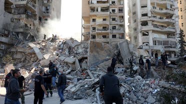 People stand on rubble at a damaged site in the aftermath of an Israeli strike in Tayouneh, amid the ongoing hostilities between Hezbollah and Israeli forces, Lebanon November 15, 2024. (Reuters)