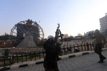 A Syrian opposition fighter fires into the air to celebrate the capture of the city of Hama on December 6, 2024. (AFP)