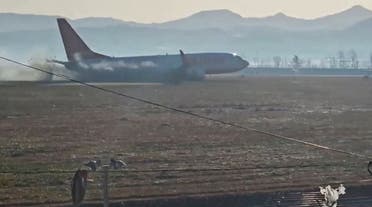 Black smoke emits from Jeju Air aircraft flight 7C2216 as it veers off the runway before crashing at Muan International Airport in Muan, South Korea, December 29, 2024 in this screengrab obtained from video. (Via Reuters)