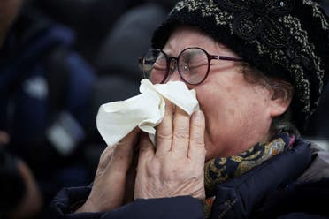 A relative of a passenger of the aircraft that crashed after it went off the runway, reacts at Muan International Airport, in Muan, South Korea, December 29, 2024. (Reuters)