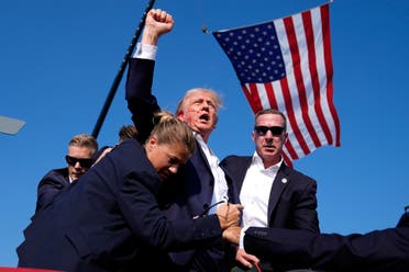 Republican presidential candidate former President Donald Trump is surrounded by U.S. Secret Service agents at a campaign rally, Saturday, July 13, 2024, in Butler, Pa. (AP)