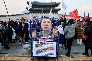 Protesters attend a rally against South Korea's impeached President Yoon Suk Yeol, who declared martial law, which was reversed hours later, in Seoul, South Korea, December 21, 2024. (Reuters)