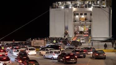 People and cars board a ferry to Piraeus, following an increase in seismic activity on the island of Santorini, Greece, February 4, 2025. REUTERS/Alkis Konstantinidis