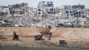 Military vehicles operate in North Gaza, amid a ceasefire between Israel and Hamas, as seen from Israel February 9, 2025. REUTERS/Amir Cohen